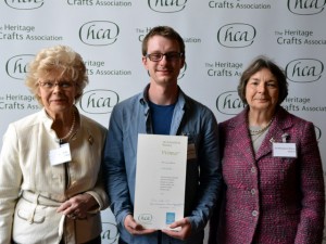 Luke Batchelor being presented with his award