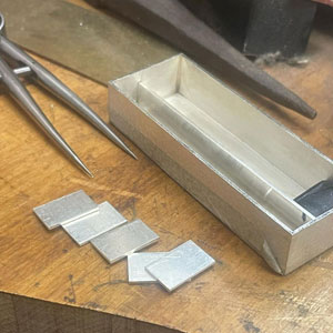 Silver box making by 2023 bursary recipient Iona Hall